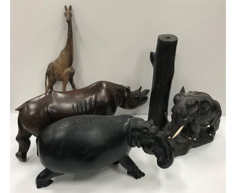 A collection of mainly African carved treen ware animal figures including hippopotamus, elephants, rhinoceros, lion, giraffe,