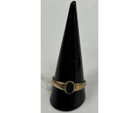 An unmarked yellow metal seal ring set with oval cut bloodstone, 3 g, size W