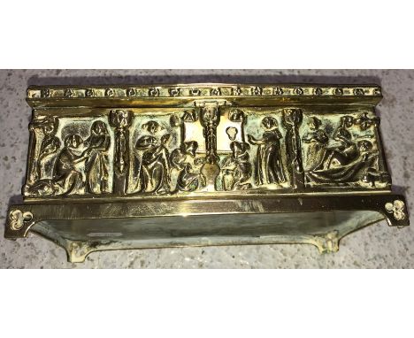 A circa 1900 German brass casket in the medieval manner with high relief decoration of religious panels bearing makers stamp 