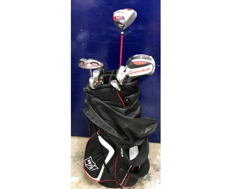 A Wilson golf bag and contents of Dunlop Tour 10.5 driver, a Deep Red putter and seven irons