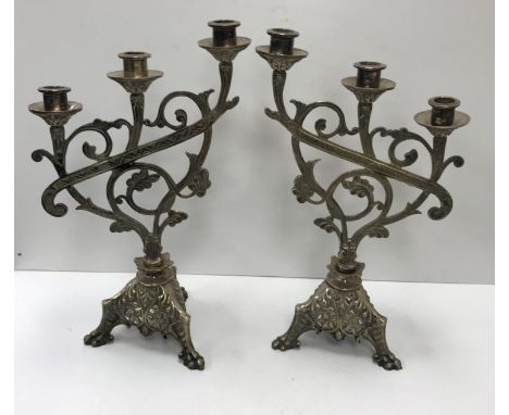 A collection of various metal and treen ware including a pair of plated three branch candelabra in the Continental Aesthetic 
