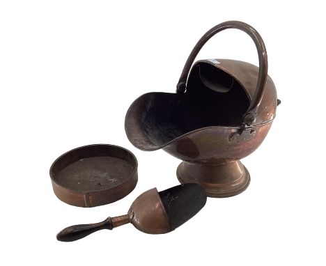 A Helmet shaped copper coal scuttle 