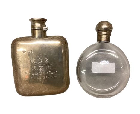 A sterling silver hip flask by John William Johnson, Lonson 1886, and a silver topped circular glass example 