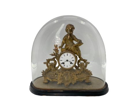 A French Japy Frere gilt mantle clock, surmounted by Cherbub figure reading a book, in a glass dome. Clock 36cm (h). Dome 40c