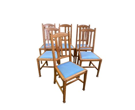 Set of 6 light coloured oak kitchen chairs, with blue seats 