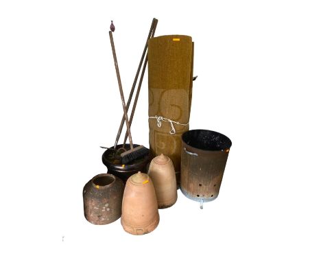 A weathered garden planter with shrub, and a quantity of other pots and planters with lids, and fire bin (one pot damaged) 