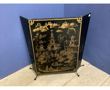 A decorative, Mid century fire screen, in the oriental taste with images of pagodas, open 82cm W x 65cm H 