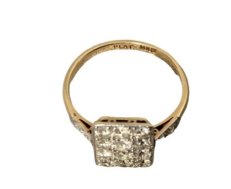 An 18ct gold and platinum diamond plaque ring, panel set with 12 single cut diamonds with diamond set shoulders, 2.75g, sizeC