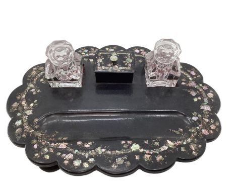 A Victorian black lacquer and inlaid mother of pearl desk tidy/standish, with original glass inkwells. Missing foot, small ch