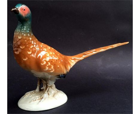 A Royal Dux ceramic pheasant, with pink triangle Dux mark, 33cmL
