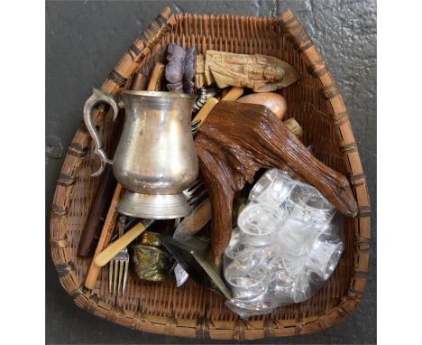 An oriental bamboo rice winnowing basket containing mixed items, including a brass candlestick, new white metal napkin rings 