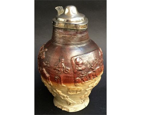 A Mortlake salt-glazed silver-mounted jug, typically decorated with a raised rectangular panel of cupds with  a lion, with hu