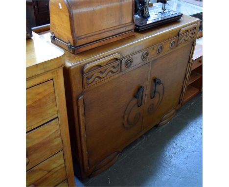 An art deco style oak sideboard, the left cupboard with one shelf, the right with internal drawer, 122cm wide