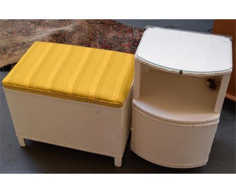 A Lloyd Loom blanket box with yellow fabric top, together with another Lloyd Loom blanket box containing a quilted bedspread,