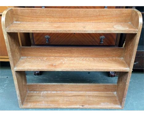 A small oak bookshelf, and a pine hanging shelf