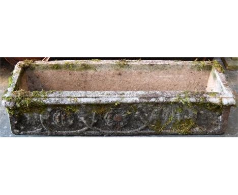 A composite stone rectangular trough planter