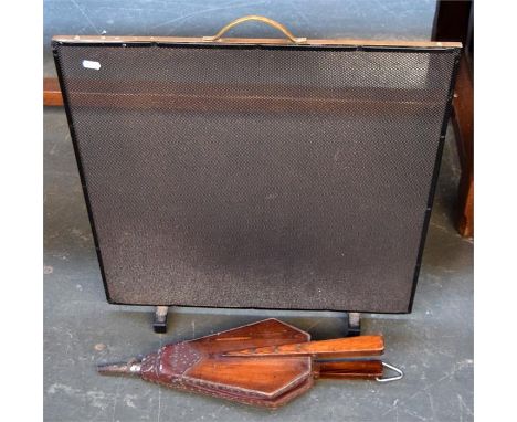 A small pair of fire bellows and brass fire screen