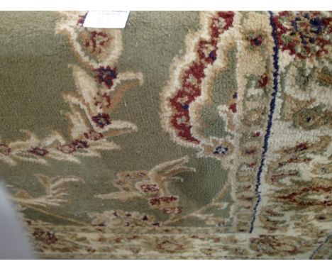 Green ground rug in clean condition, 120 x 180 cm. This item is not available for in-house P&amp;P. 