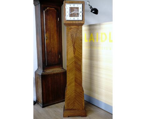A fine Art Deco walnut grandmother clock, the pendulum movement striking on gongs and having a square face with Arabic numera