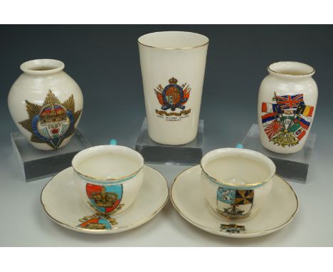 Two W.H. Goss cups and saucers together with three similar crested pots