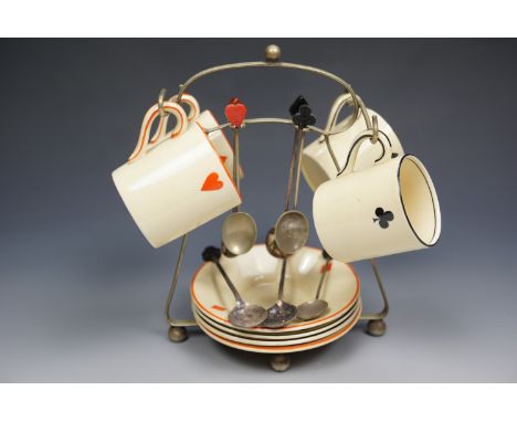 A 1920s Royal Venton Ware "bridge" coffee set with spoons and electroplate stand, the spoon terminals in the form of playing 
