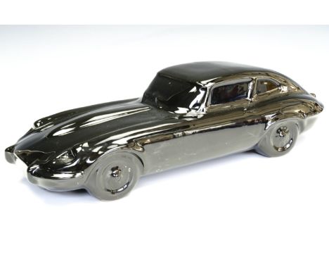 A glazed ceramic model of a Jaguar E-Type, 38 cm