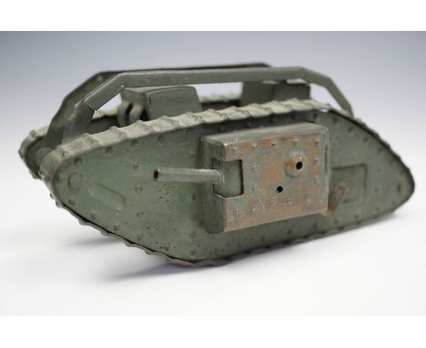 A fine Great War period hand-made brass model / toy British Mk I "male" tank, green painted, given its detailed construction,