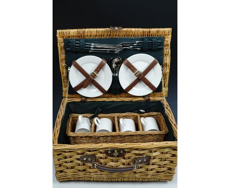 A wicker picnic hamper and contents 