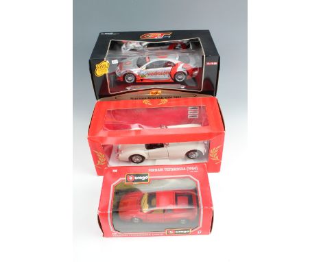 A Maisto 'Vodaphone AMG-Mercedes 2002' 1:18 scale die-cast model car together with two others 