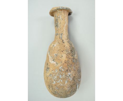 An ancient Roman iridescent glass bottle, 1st - 3rd C CE, 8 cm [Purchased from Ancient Art, The Vale, London]