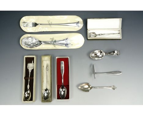 A silver teaspoon, an electroplate feeding spoon and pusher, two Masonic spoons and pickle fork etc