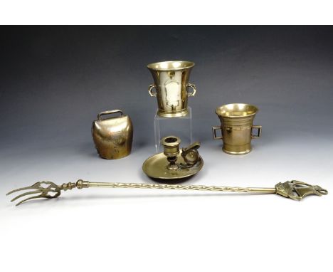Two 19th century brass mortars, with a 19th century brass chamber stick, a cowbell, and a Victorian articulated toasting fork