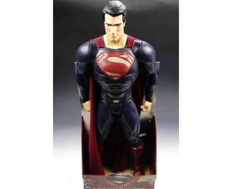 A large Superman 'Man of Steel' action figure in original packaging, 79 cm