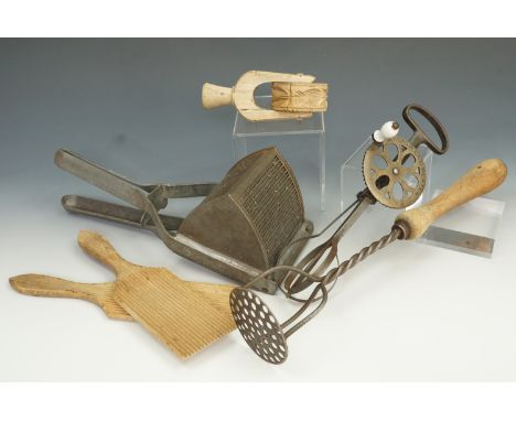 Kitchenalia, to include potato ricer, treen pastry roller, 'Boston egg beater', masher, and butter patts (6).