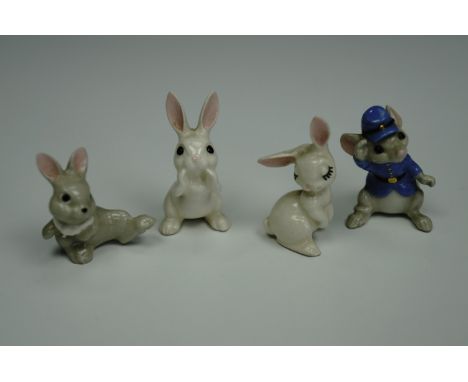 Three miniature novelty ceramic Whimsie-like figurines modelled as comical rabbits, together with one other anthropomorphic m