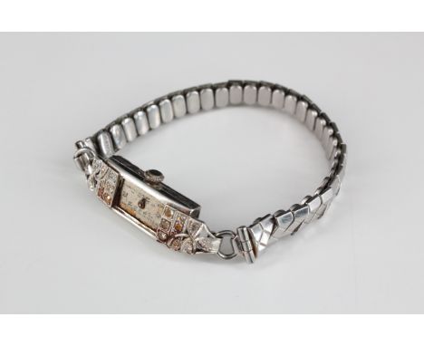 A 1920s lady's Art Deco platinum and diamond wristwatch, 36 mm x 11 mm, (a/f), 17.5 g