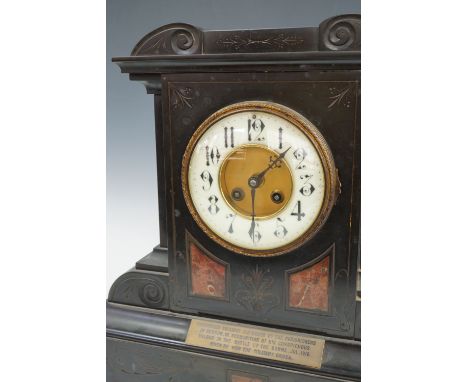 An early 20th Century marble and polished black slate architectural mantel clock, bearing a brass plaque with engraved presen