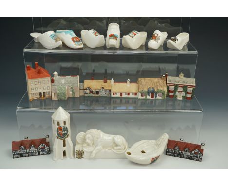 A quantity of W.H. Goss crested ceramic shoes together with a quantity of Goss 'Famous Homes' etc