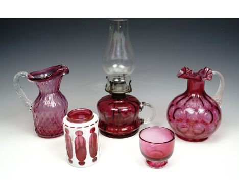 Victorian cranberry glass chamber oil lamp, with two cranberry glass jugs and a small basin, with a white cased red glass Boh