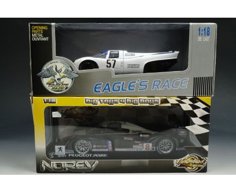 A Norev 1:18 scale die-cast model of a Peugeot 908 together with another 