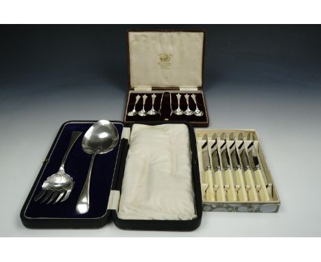 A cased set of electroplate Art Deco inspired teaspoons and sugar tongs together with a cased desert serving set and boxed bu