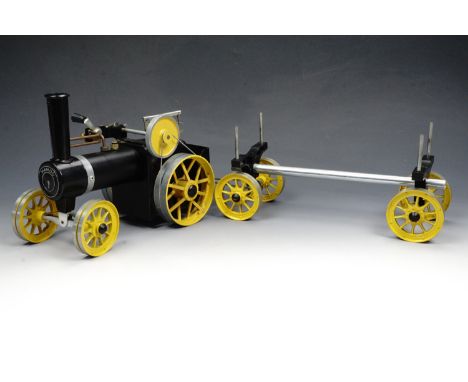 A Mamod traction engine with log trailer, circa 1980s, in original box