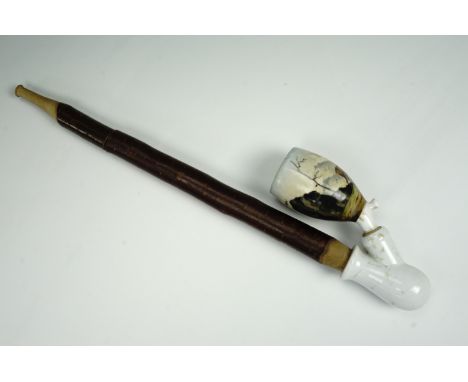 A late 19th / early 20th century German tobacco pipe having a ceramic bowl and mount depicting deer in woodland