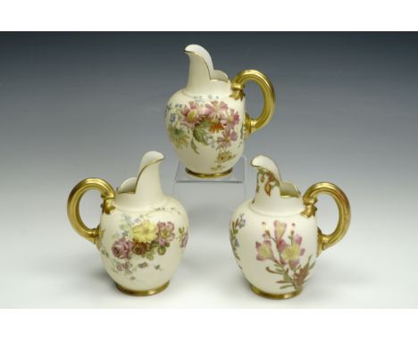 Three Royal Worcester blush ivory jugs, comprising a pair with floral decorated bodies and a third with all over floral decor