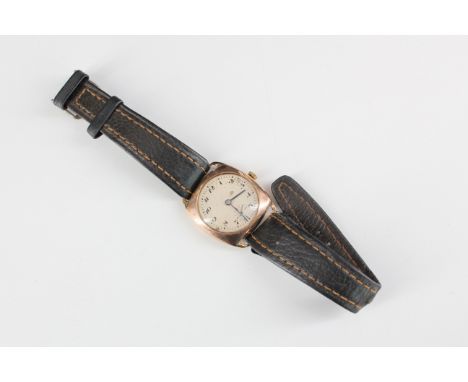 A 1940s 9 ct gold wristwatch, having a manual wind movement and circular face with cursive Arabic numerals, blued steel hands