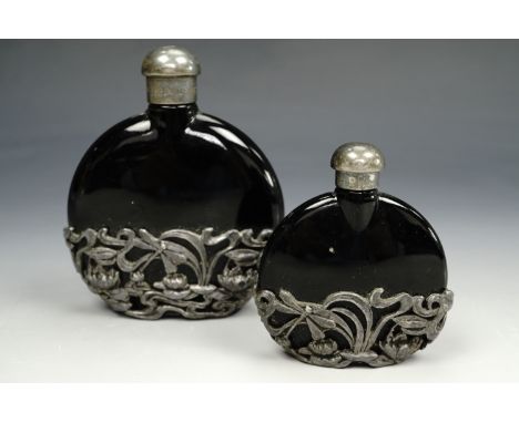A pair of Art Nouveau influenced perfume bottles, tallest 9.5 cm