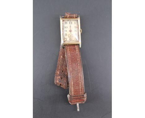An Art Deco style 18 ct gold wristwatch, having a Peerless movement and rectangular case, circa 1930, (a/f), 37 mm x 22 mm, 2