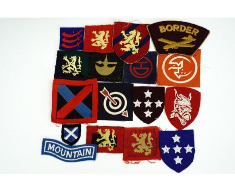 Sundry items of British army cloth insignia including printed Highland and 78th infantry division flashes, a 6th Anti-Aircraf