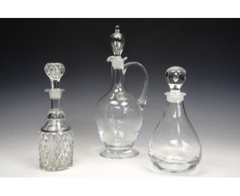 A large glass wine decanter together with a cut glass decanter and one other, tallest 40 cm