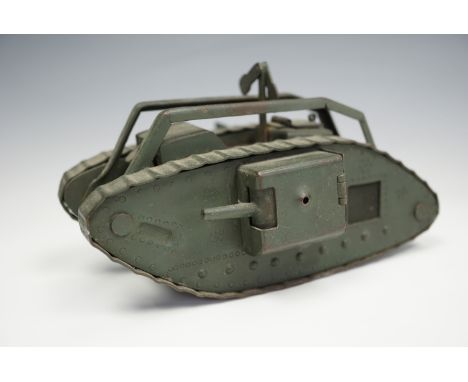 A fine Great War period hand-made brass model / toy British Mk I "male" tank, green painted, given its detailed construction,